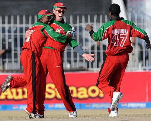 Gary Brent is congratulated by team-mates for taking a catch to dismiss Nasir Jamshed