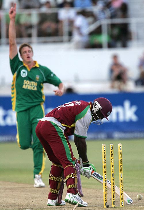 Rawl Lewis is cleaned up by Morne Morkel