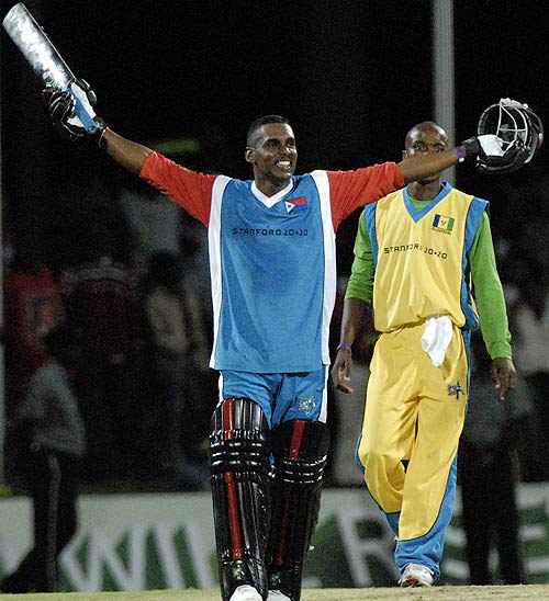 John Eugene acknowledges the cheers after scoring an unbeaten 100 off 46 balls