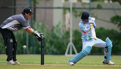 India's Turuwar Kohli slashes the ball to the off side