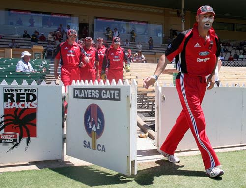 Matthew Elliott leads the Redbacks onto the field in his final one-day match