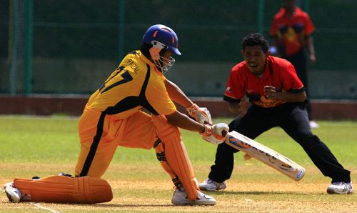 Malaysia's Faizal Abu Hasan sweeps en route to his fifty