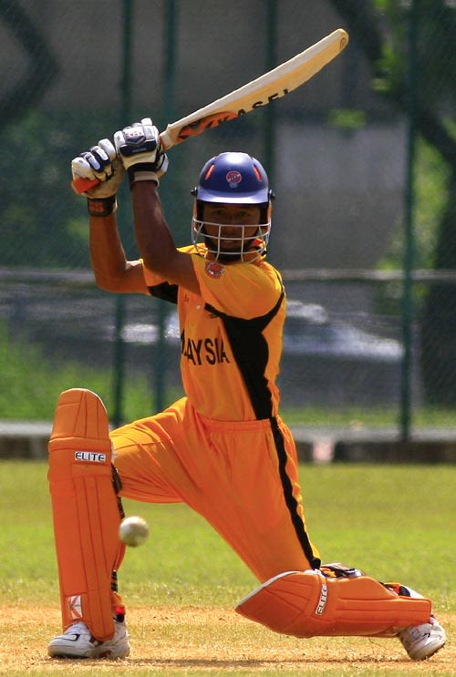 Malaysia's Norwira Zazmie drives the ball square