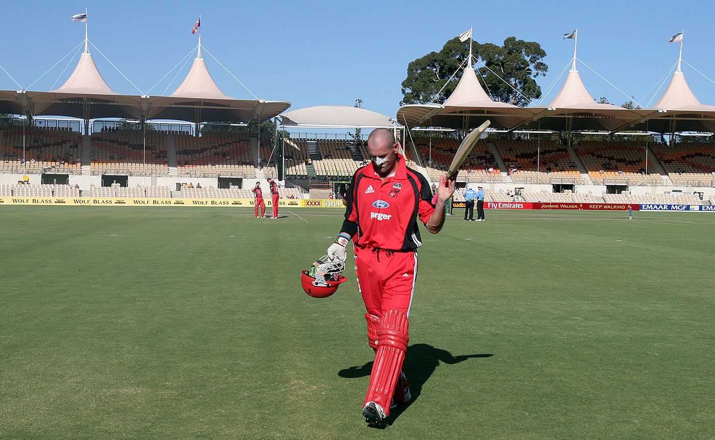 A bashful Matthew Elliott takes the applause as he leaves the field for the last time in a state match