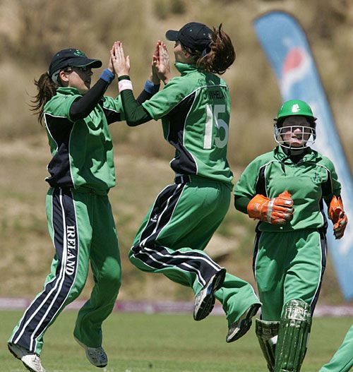 Jill Whelan and Cecelia Joyce celebrate the wicket of Kari Anderson