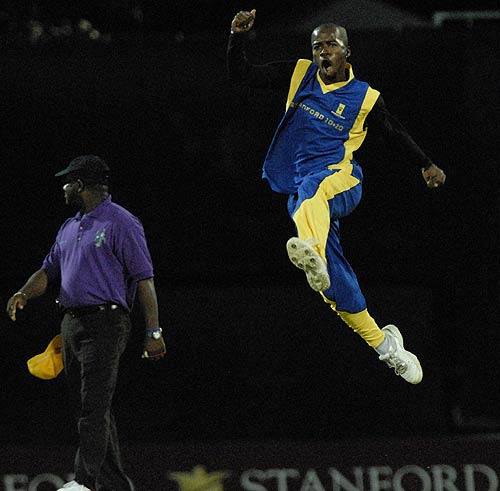 Derrick Bishop celebrates the dismissal of William Perkins