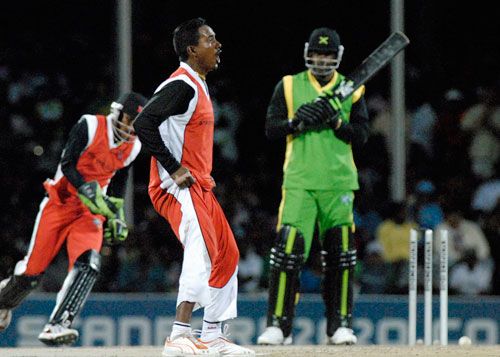 Dave Mohammed roars his delight at bowling Chris Gayle