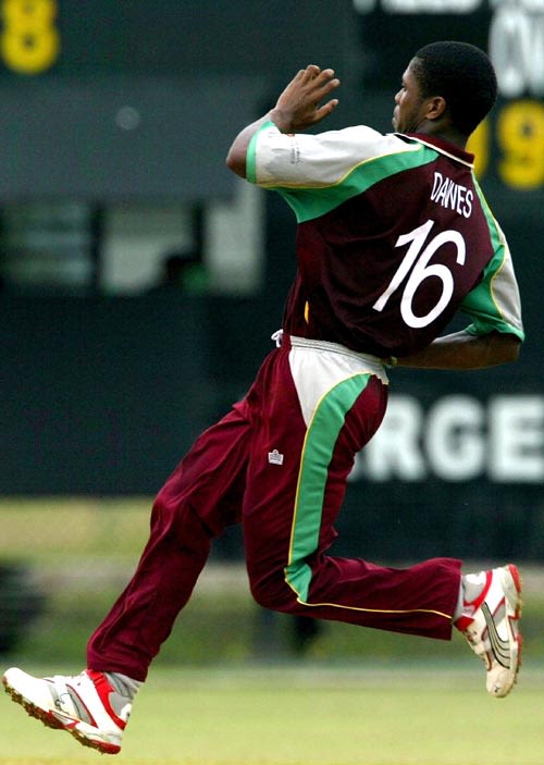 Jason Dawes runs in to bowl against Nepal