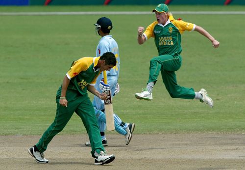Wayne Parnell and Sybrand Engelbrecht celebrate Taruwar Kohli's dismissal