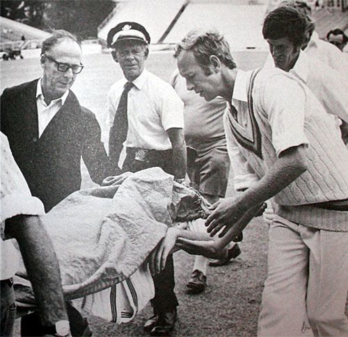 An unconscious Ewen Chatfield is stretchered off the field