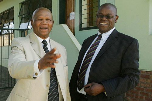 Ray Mali and Peter Chingoka share a joke