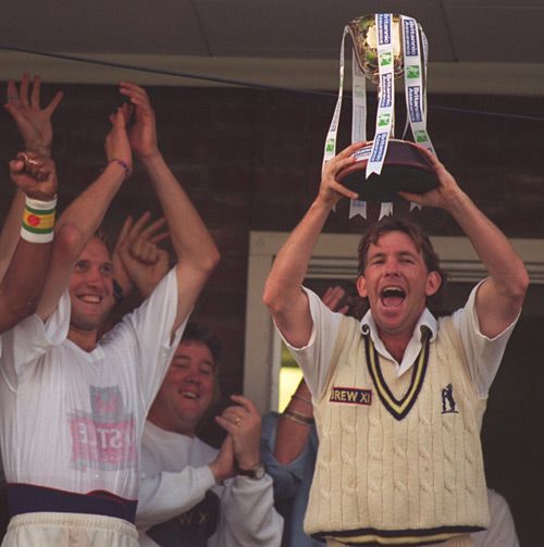 Dermot Reeve lifts the County Championship trophy