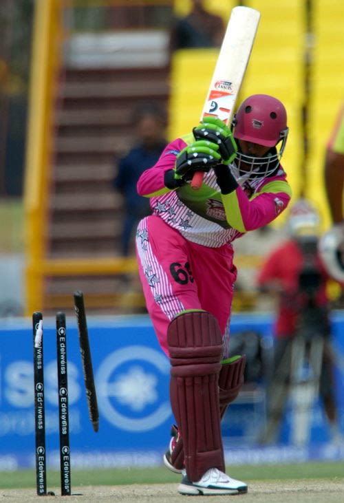 Russel Arnold is bowled by Abu Nechim