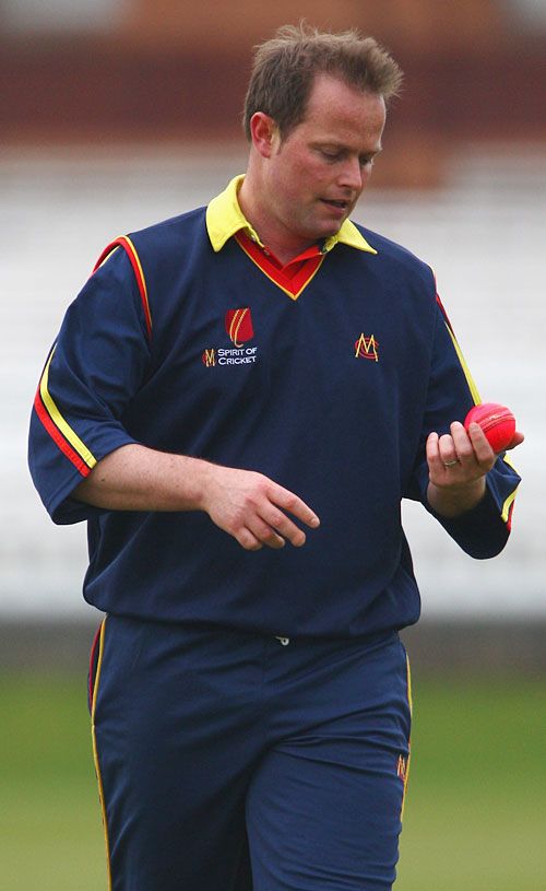 MCC's James Hamblin examines the pink ball during its trial at Lord's
