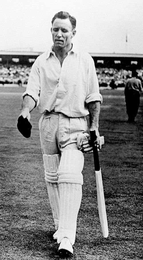 Ray Lindwall walks out to bat
