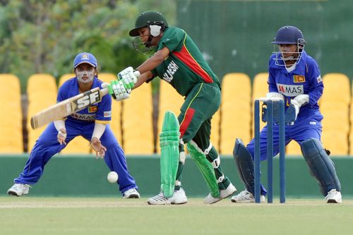 Ayesha Akhter drives the ball during her 24