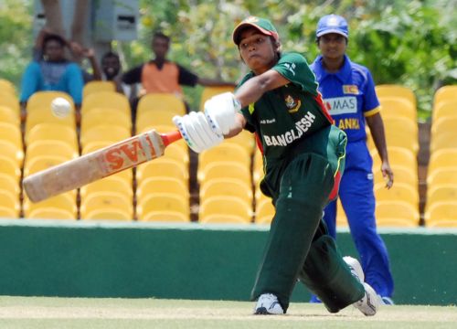 Tithy Sarkar stretches out to play a shot