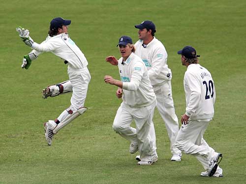 Tim Burrows shows his joy after catch Usman Afzaal