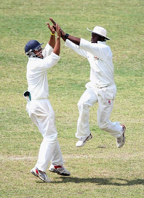 Simon Jackson and Xavier Marshall celebrate the fall of Simon Katich