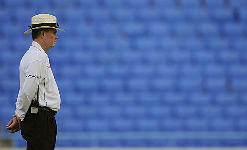 Russell Tiffin, with a bank of empty seats in the background, officiates in the second Test between West Indies and Australia