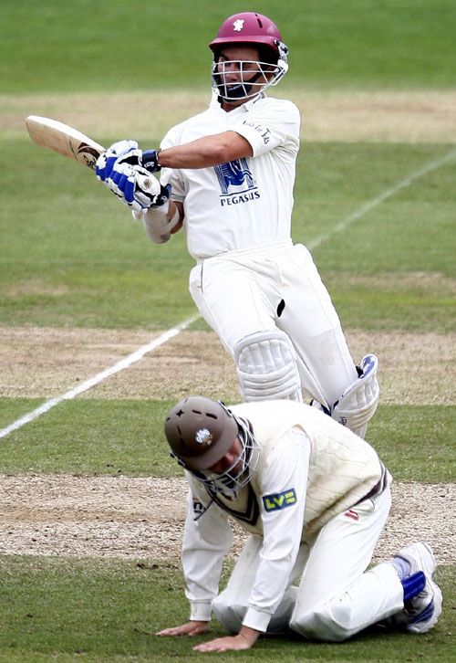 Justin Langer causes Chris Murtagh to take evasive action