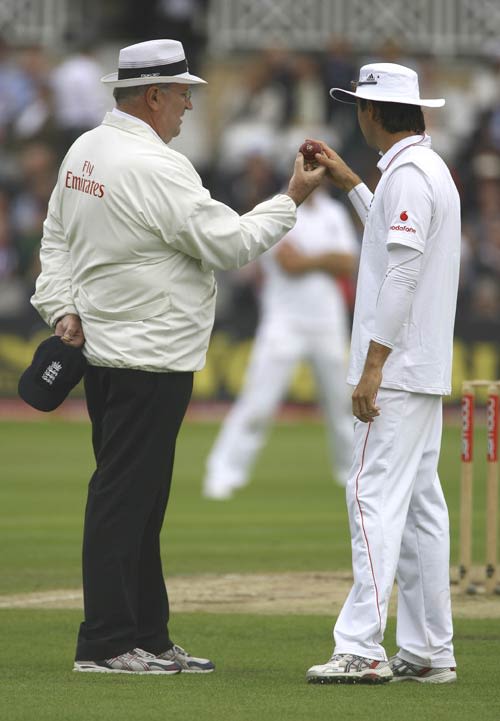 Michael Vaughan and Darrell Hair inspect the ball