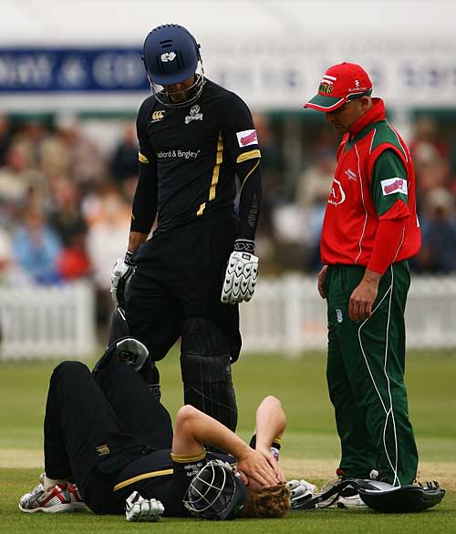 An injured Andrew Gale lies on the ground in pain