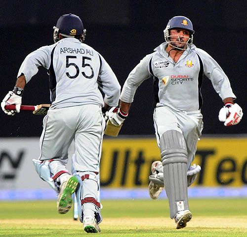 Arshad Ali and Amjad Ali rush for a run
