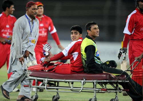 A ride for two: Zain Abbas and Younis Khan are stretchered off
