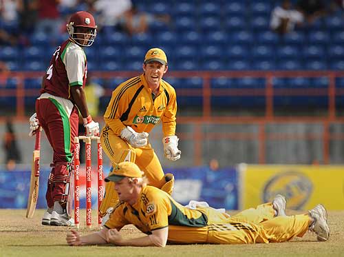 Patrick Browne and Luke Ronchi look on as Cameron White holds a good catch