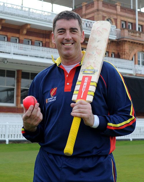 Darren Bicknell poses with the new MCC-pioneered pink ball