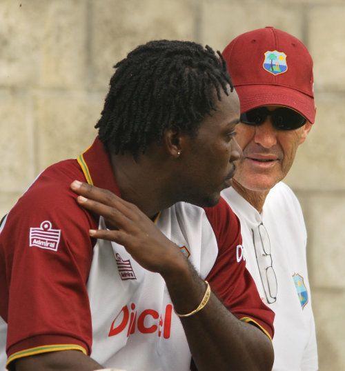 Chris Gayle talks to coach John Dyson ahead of the third ODI against Sri Lanka