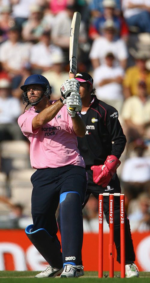 Tyron Henderson launches one of his seven huge sixes to take Middlesex into the final