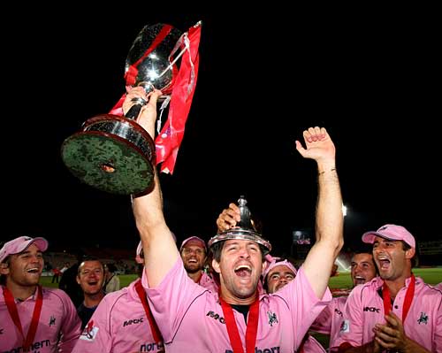 Tyron Henderson leads the Middlesex party after he pulled out two late yorkers to seal the victory