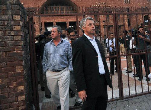 Tim May and Dave Richardson, members of the ICC task force, leave the PCB headquarters