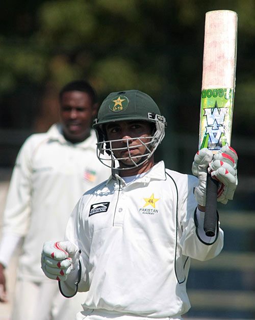 Ali Asad acknowledges applause for his century