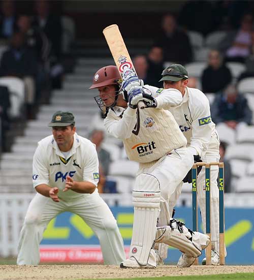 Lee Hodgson drives during his half-century on debut for Surrey