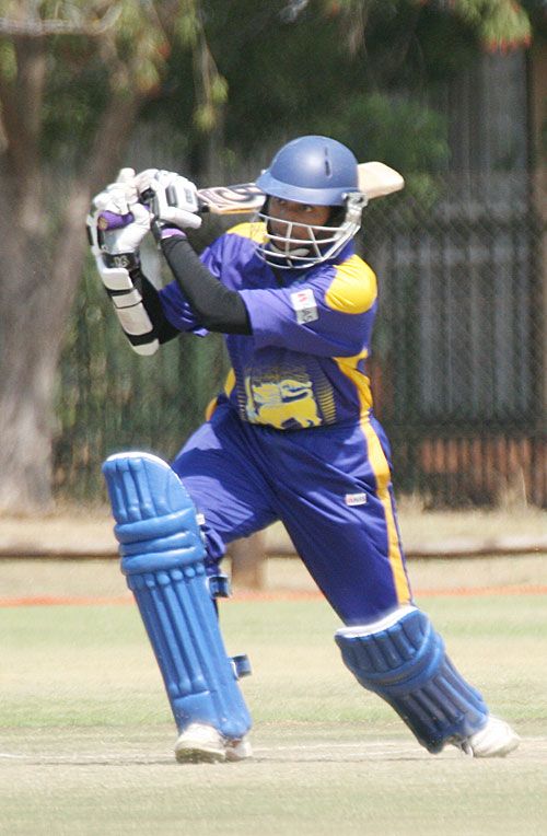 Kanchana Gunawardene drives down the ground during his 90