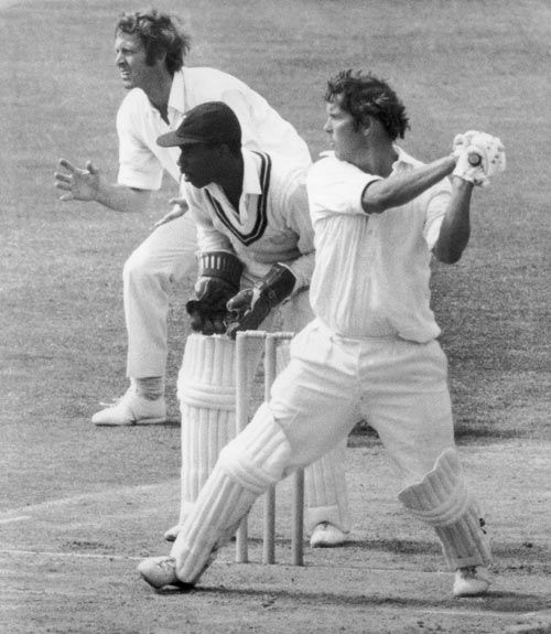 John Hampshire cuts the ball