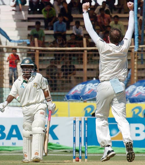 Iain O'Brien is a happy man after getting Rajin Saleh bowled