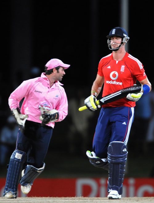 Ben Scott celebrates stumping the departing Kevin Pietersen
