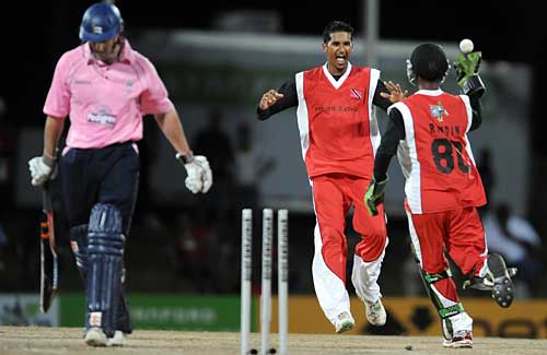 Sherwin Ganga celebrates as Andrew Strauss departs