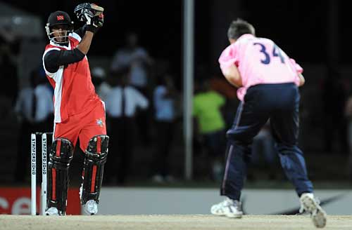 William Perkins drives a catch straight back at Tim Murtagh