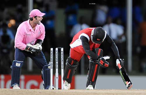 Ben Scott pulls off a sharp stumping to remove Daren Ganga