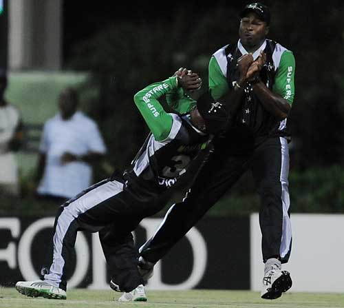 Dave Mohammad clings onto his catch despite a collision