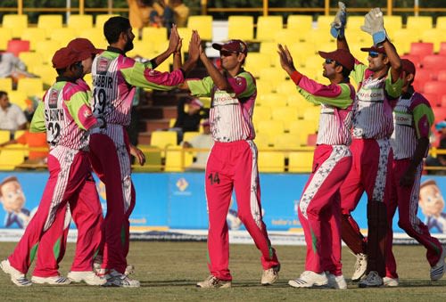 Shabbir Ahmed celebrates a wicket with his team-mates