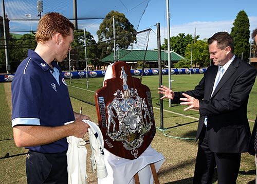Nathan Rees and Dominic Thornely admire the Sheffield Shield Trophy