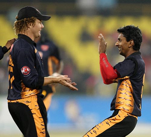 Hamish Marshall and Upul Chandana celebrate the fall of a wicket
