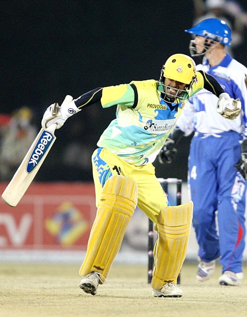 TP Singh punches the air on reaching his fifty