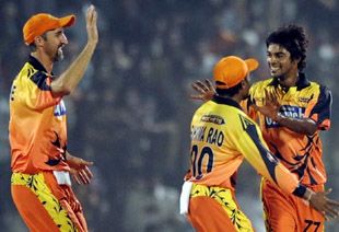 The Ahmedabad Rockets' players celebrate a wicket